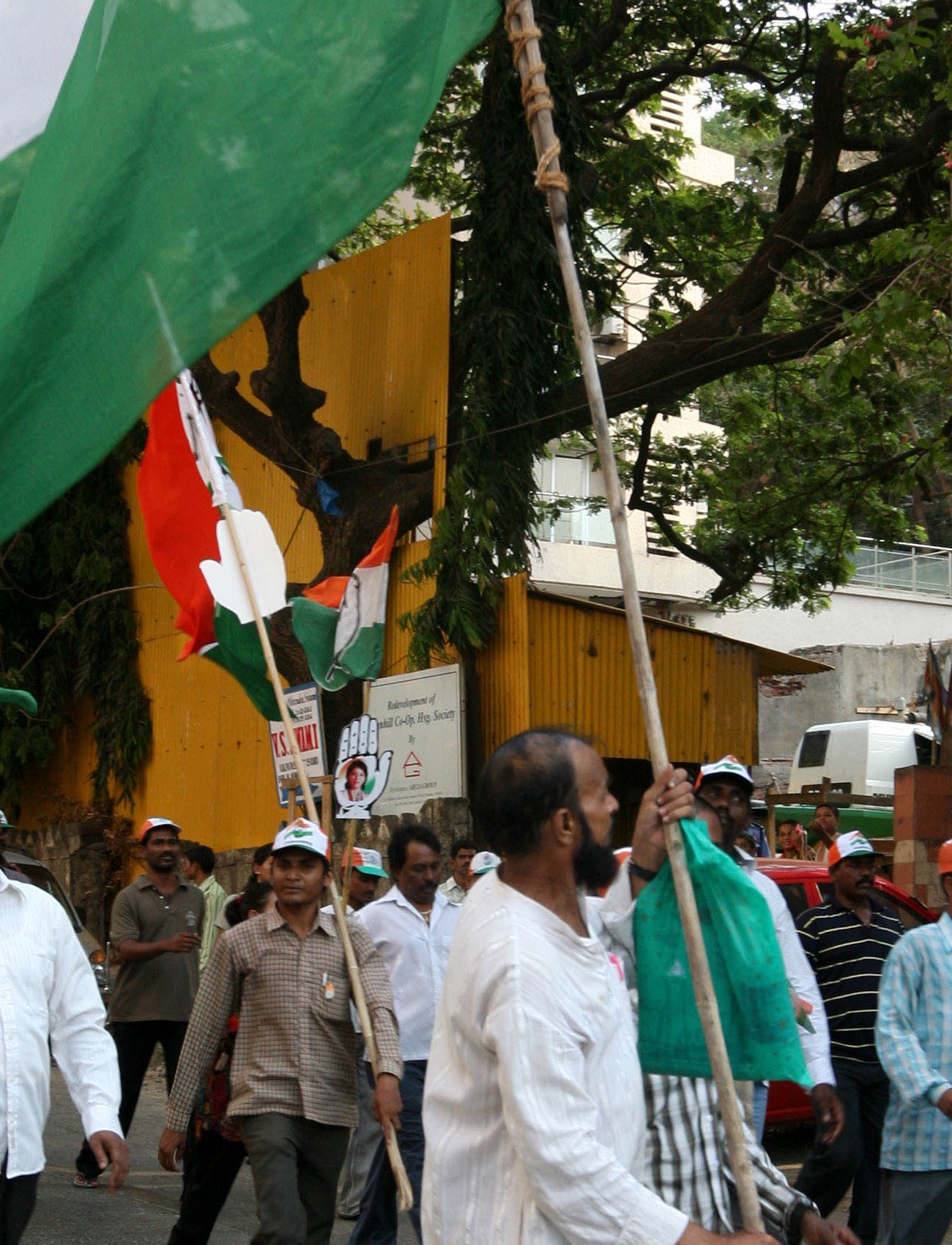 Crowd at an Indian political rally listening to campaign messaging